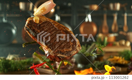 Tasty Beef Steak Flying up in the Air. 113001262