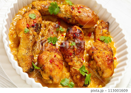 chicken drumsticks in pineapple sauce, top view chicken drumsticks in pineapple sauce, top view 113001609