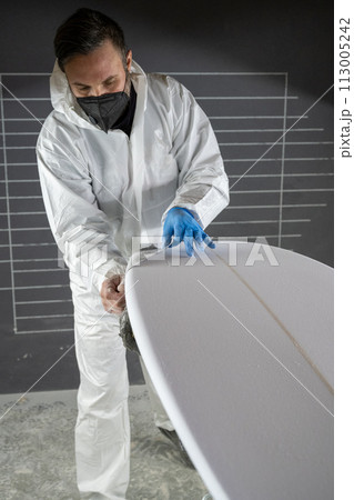 Shaper working on surf board Shaper working on surf board 113005242