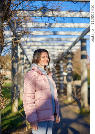 Winter Fun in Bitigheim-Bissingen: Beautiful Girl in Pink Jacket Amidst Half-Timbered Charm. a lovely girl in a pink winter jacket standing in the archway of the historic town of Bitigheim-Bissingen Winter Fun in Bitigheim-Bissingen: Beautiful Girl in Pink Jacket Amidst Half-Timbered Charm. a lovely girl in a pink winter jacket standing in the archway of the historic town of Bitigheim-Bissingen 113005416