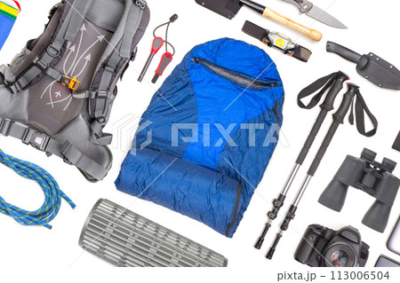 Set of tourist trekking items on white background. Top view of accessories for travel.  113006504