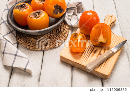 Orange persimmons Orange persimmons 113006886