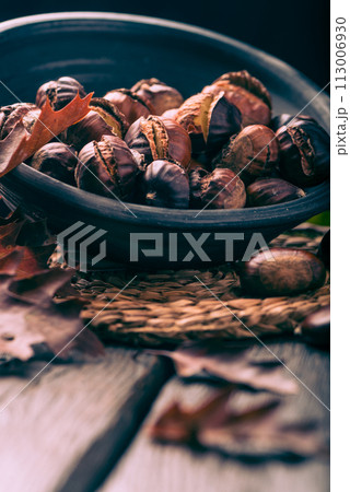 Roasted chestnuts and leaves Roasted chestnuts and leaves 113006930