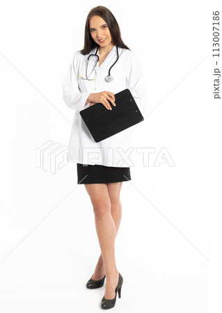 Young lady doctor on internship, waiting to issue an order in a new workplace. Young lady doctor on internship, waiting to issue an order in a new workplace. 113007186