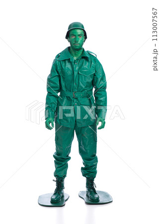 Man on a green toy soldier costume Man on a green toy soldier costume 113007567