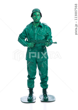 Man on a green toy soldier costume Man on a green toy soldier costume 113007568