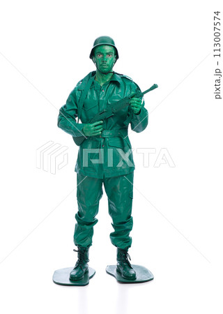 Man on a green toy soldier costume Man on a green toy soldier costume 113007574
