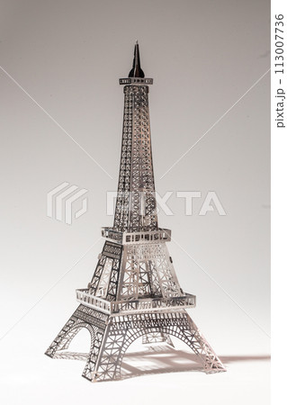 Delicate metal Eiffel Tower model on white background 113007736