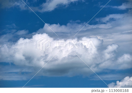 Bright landscape of white puffy cumulus clouds on blue clear sky. 113008188