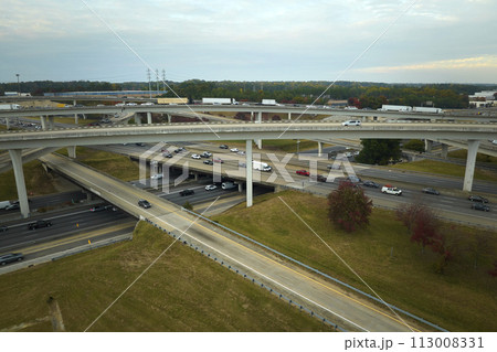 Aerial view of american freeway intersection with fast moving cars and trucks. USA transportation infrastructure concept 113008331