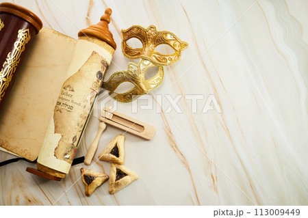 Purim background. Scroll of Esther, haman's ears cookies.and Purim Festival objects Purim background. Scroll of Esther, haman's ears cookies.and Purim Festival objects 113009449