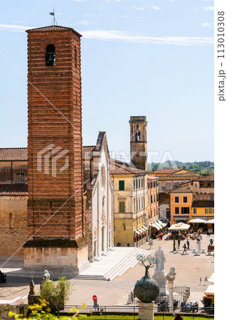 Cityscape of medieval Italian town Pietrasanta, main square, roofs of small houses, aerial view Cityscape of medieval Italian town Pietrasanta, main square, roofs of small houses, aerial view 113010308
