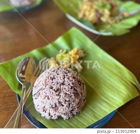 Delicious and healthy Thai food with fresh herbs for lunch. 113012904