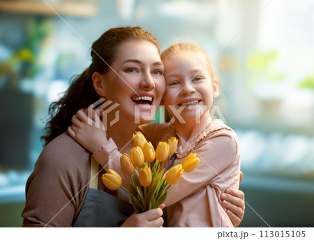 daughter and mom with flowers 113015105