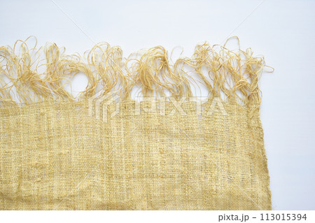 torn sackcloth isolated on white background, burlap fabric texture for design 113015394