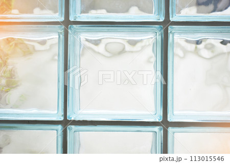 close up glass block wall with golden natural light background, interior design close up glass block wall with golden natural light background, interior design 113015546