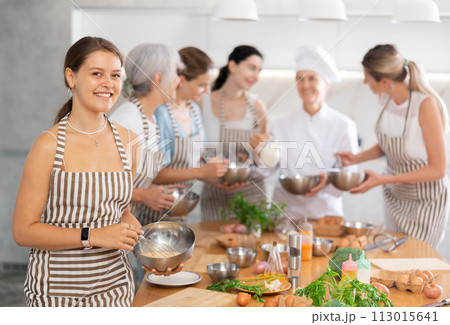 Young woman learns to cook at master class 113015641