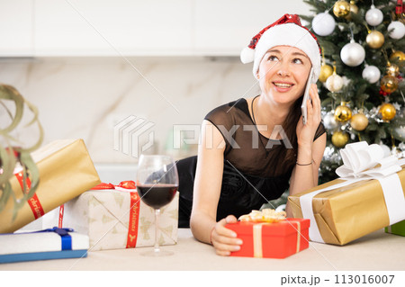 girl in New Year s atmosphere speaks on phone 113016007