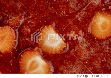 juice and pieces of strawberries after pressing juice and pieces of strawberries after pressing 113018902