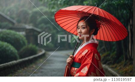 Portrait of a beautiful attractive Asian woman in traditional Japanese clothing, kimono, with an umbrella Portrait of a beautiful attractive Asian woman in traditional Japanese clothing, kimono, with an umbrella 113019597