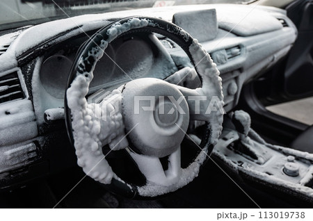 Car interior in a layer of cleaning foam. Car interior in a layer of cleaning foam. 113019738