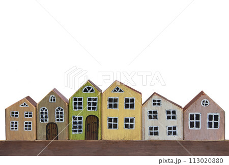 Wooden toy houses on a white background. Miniature town made of wood. Wooden toy houses on a white background. Miniature town made of wood. 113020880
