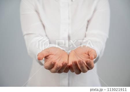 Close-up of female hands with palms up.  113021911