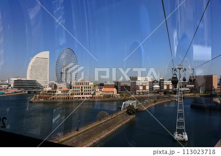 Views from riding in Yokohama Air Cabin showing Yokohama's Minatomirai area from above through the mirrored windows. In Yokohama Japan. 113023718