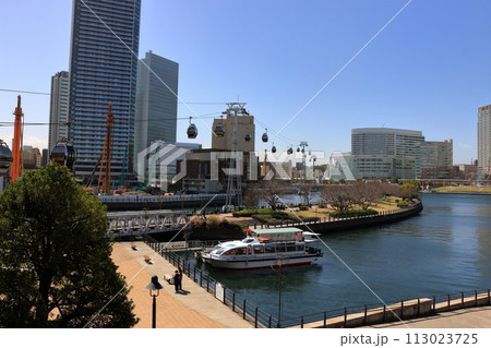 Views from riding in Yokohama Air Cabin showing Yokohama's Minatomirai area from above through the mirrored windows. In Yokohama Japan. 113023725