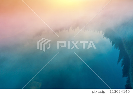 Early foggy morning. Sunrise over the lake. Bird's-eye. Lake Synevyr, Transcarpathia, Ukraine Early foggy morning. Sunrise over the lake. Bird's-eye. Lake Synevyr, Transcarpathia, Ukraine 113024140