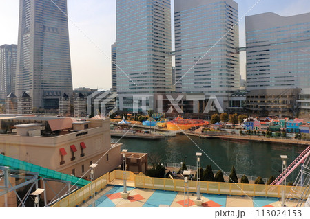 Views of Yokohama Minatomirai as seen from the Cosmo Clock 21 ferris wheel at the Cosmo World amusement park in minato mira 21 district of yokohama japan, originally the world's tallest ferris wheel. 113024153