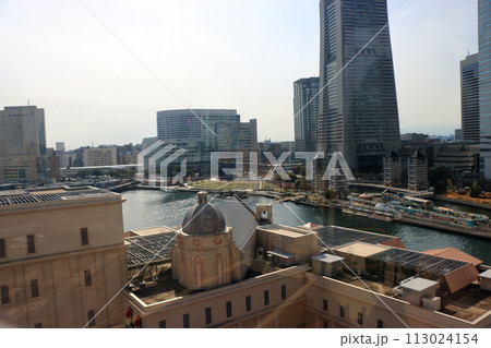 Views of Yokohama Minatomirai as seen from the Cosmo Clock 21 ferris wheel at the Cosmo World amusement park in minato mira 21 district of yokohama japan, originally the world's tallest ferris wheel. 113024154