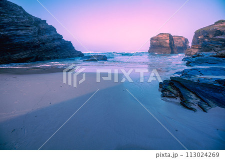 Seascape in the morning. Rocky sea coast at sunrise. Beach Playa de Las Catedrales in Ribadeo, Galicia, Spain, Europe 113024269