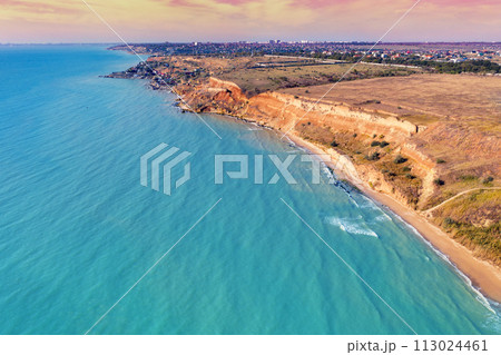 Seascape with sea and city on the clay steep coast. Aerial view towards Fontanka, Odesa, Ukraine 113024461