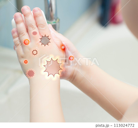 A child washes his hands with soap in the bathroom. The concept of hygiene and clean hands, infection, close-up, soundness 113024772
