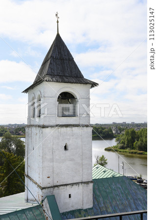 Medieval brick tower with wooden roof and weather vane in Yaroslavl, Russia 113025147
