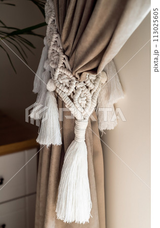 curtain tieback in boho style in interior curtain tieback in boho style in interior 113025605