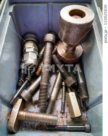 Detail of different metallic bolts and nuts in the toolbox 113025830