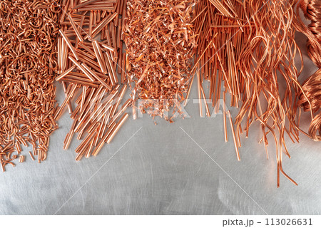 Copper scrap, raw material industry on metal background Copper scrap, raw material industry on metal background 113026631
