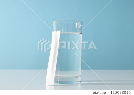 Collagen in a white stick with a glass of water 113028010