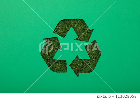 Material recycling sign on a green background Material recycling sign on a green background 113028058