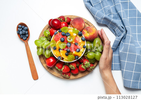 Tasty and healthy nutrition concept - fruit salad 113028127