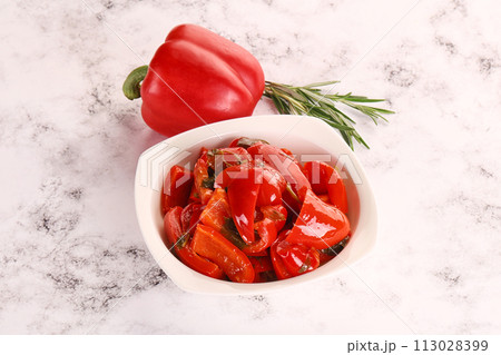 Pickled red bell pepper in the bowl 113028399