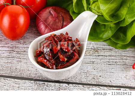 Dry tomato in olive oil Dry tomato in olive oil 113028412