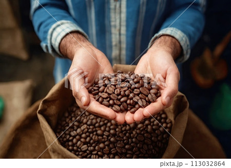 Male hands in close-up holding organic fresh roasted coffee beans over bag of coffee harvest. AI generation 113032864