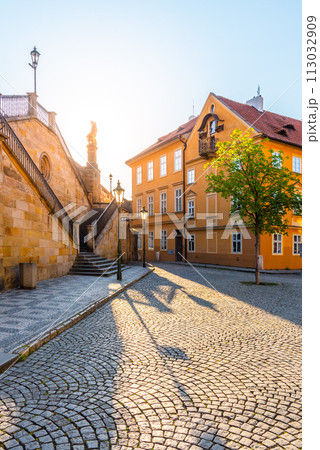Na Kampe - small square under Charles Bridge on sunny day. Kampa Island, Prague, Czech Republic. 113032909