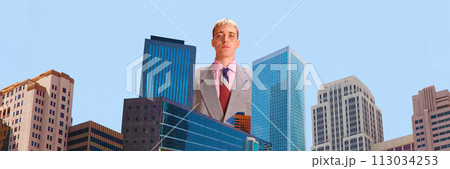 Giant image of man in suit, businessman with serious face standing between skyscrapers. Business development. Contemporary art collage. 113034253
