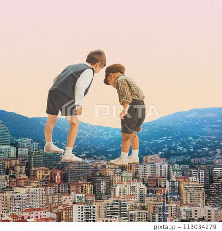 Two boys, little children standing above city and mountain landscape and looking down with curiosity. Contemporary art collage. 113034279