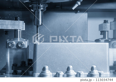 The CNC milling machine cutting mold parts with flat end mill tool in the light blue scene. 113034744