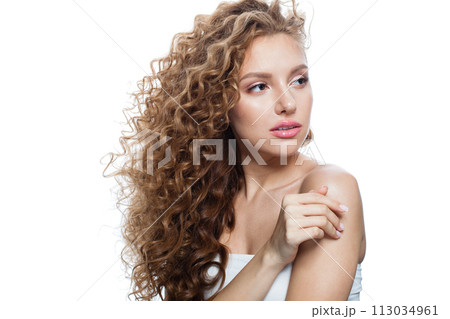 Gorgeous good-looking redhead woman with clean skin, curly hairstyle and natural make-up. Gorgeous good-looking redhead woman with clean skin, curly hairstyle and natural make-up. 113034961